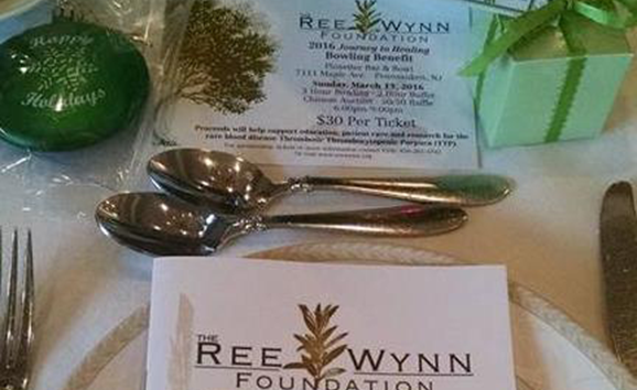 Ree Wynn Foundation Program on a table with two spoons.